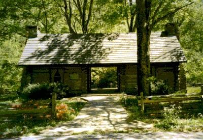 Replica of Rev. McAdow's log cabin and the 1810 Cumberland Presbyterian Church, passed by the Ore Pit Loop at Montgomery Bell State Park