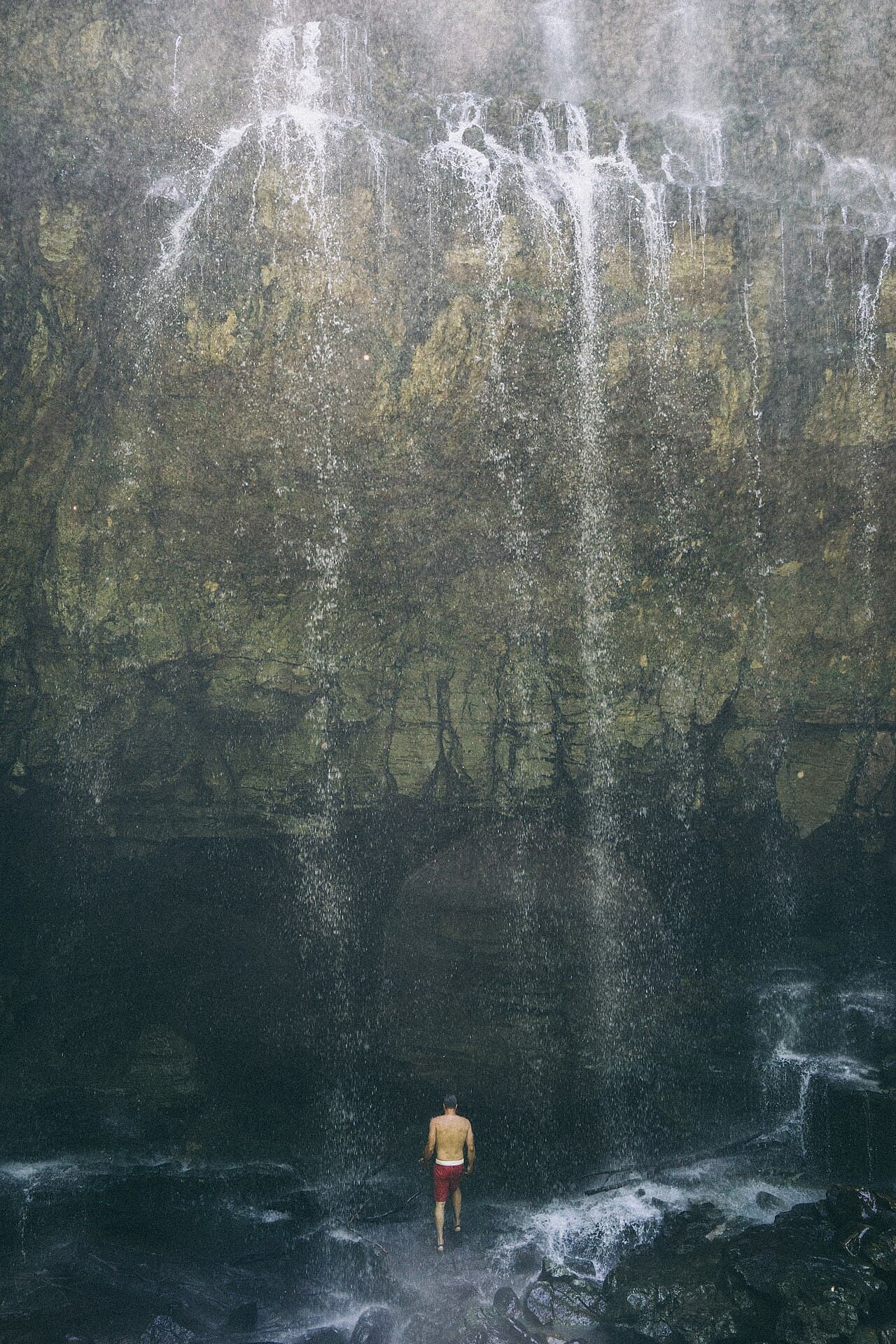Virgin Falls cascading over a mossy cliff into the gorge
