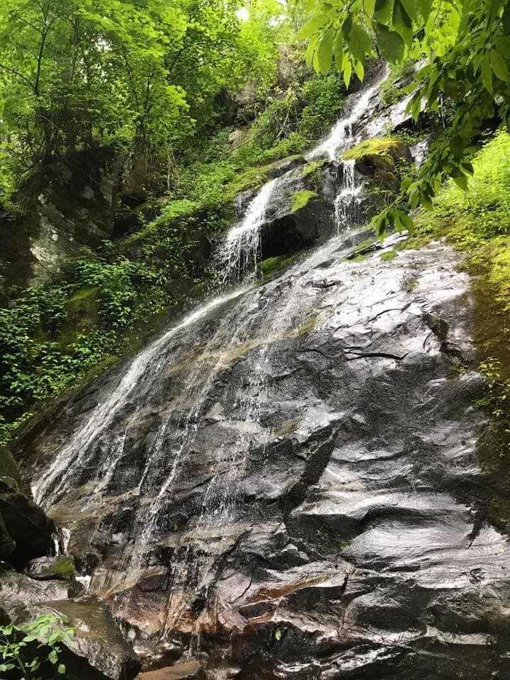 The 90-foot Hen Wallow Falls fanning out across a broad rock face in the Smokies